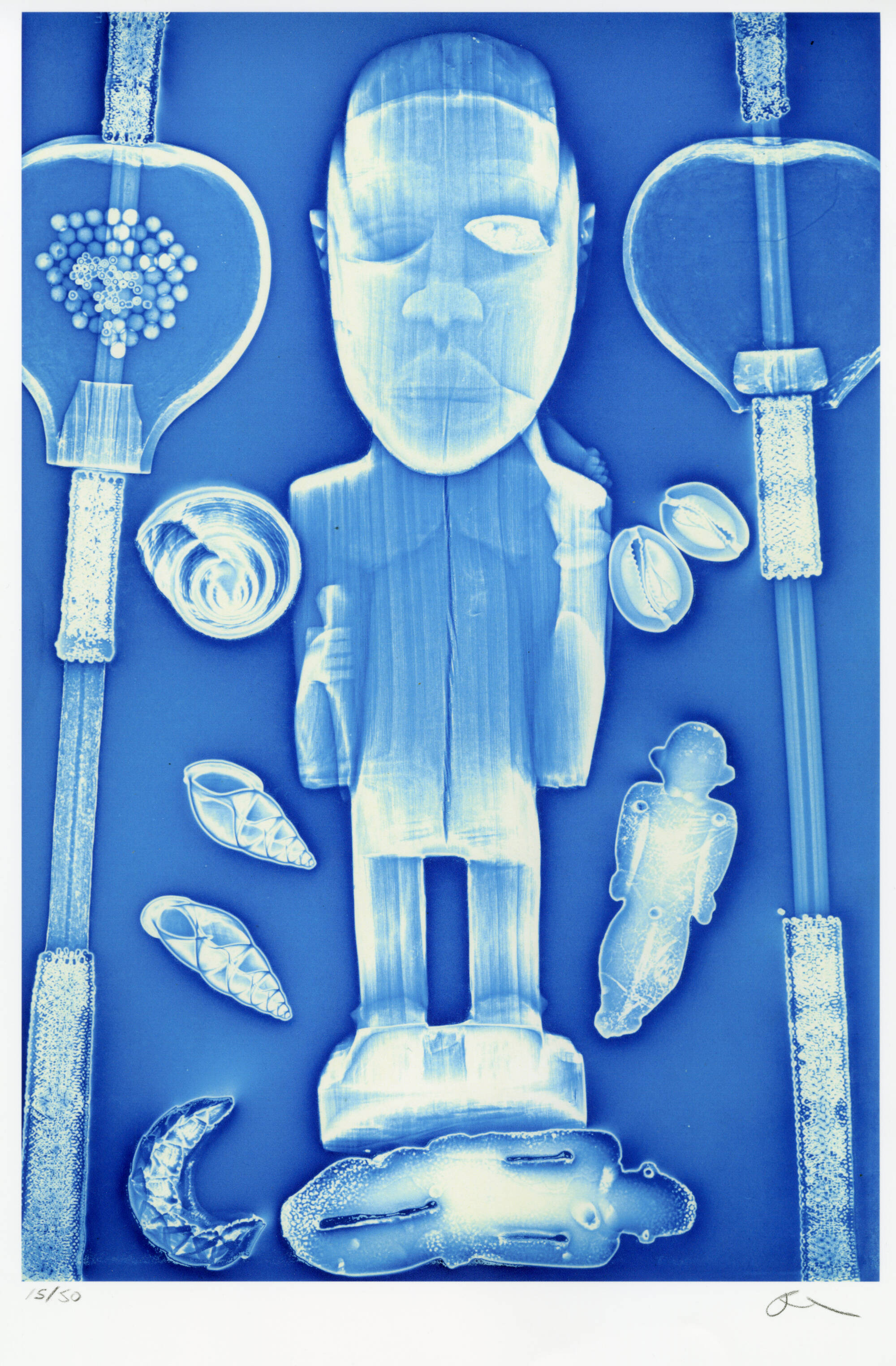 Bright blue photograph that looks like an x-ray of an African sculpture.